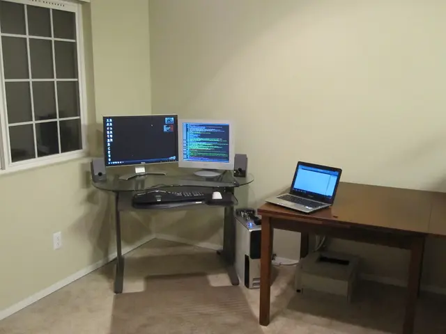 On this table there is a laptop. Under the table there is a printer. These are monitors, keyboard,...