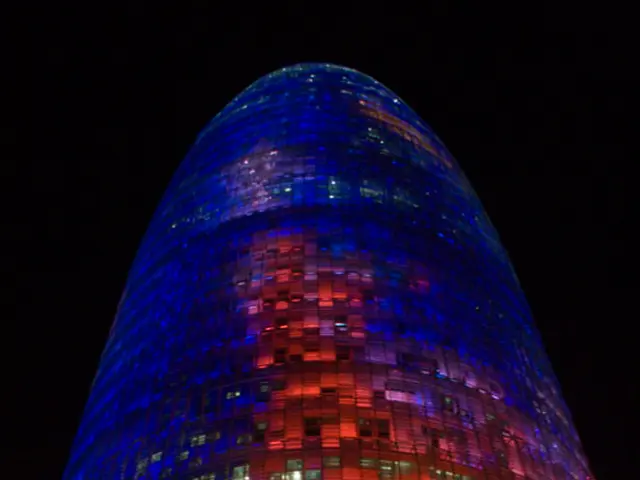 In this image in the center there is a building.