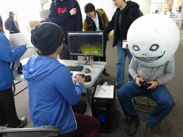 In this image we can see one member is sitting on the chair. In front of him one table is there and...