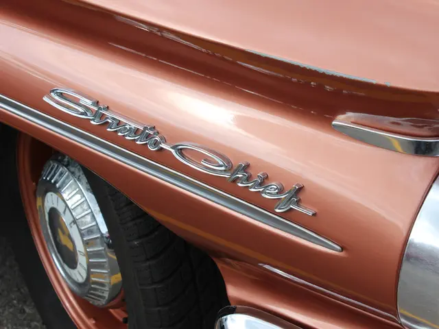 In the picture I can see a vehicle on which there is something written on it.