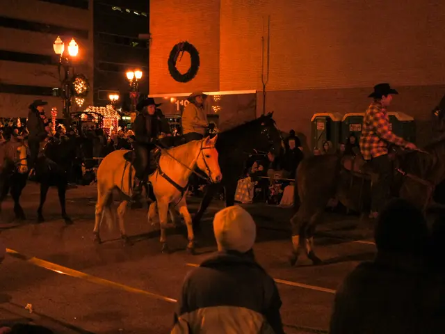 In this image there are group who are riding horses in the street.